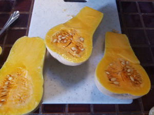 butternut squash cut in half with seeds